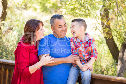 Mixed Race Caucasian and Hispanic Family At The Park.