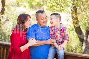 Mixed Race Caucasian and Hispanic Family At The Park.