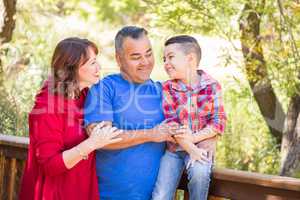 Mixed Race Caucasian and Hispanic Family At The Park.