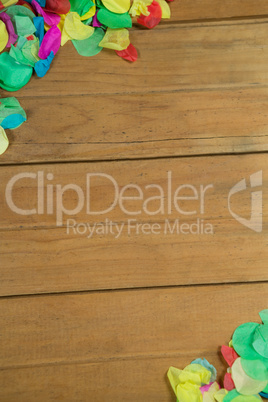 Confetti on wooden surface