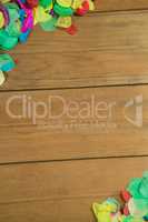 Confetti on wooden surface