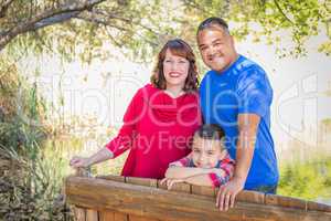 Mixed Race Caucasian and Hispanic Family At The Park.