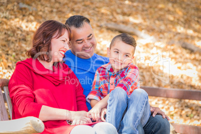 Mixed Race Caucasian and Hispanic Family At The Park.