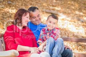 Mixed Race Caucasian and Hispanic Family At The Park.