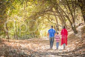 Mixed Race Caucasian and Hispanic Family Taking a Walk At The Pa