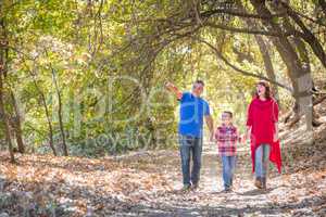 Mixed Race Caucasian and Hispanic Family Taking a Walk At The Pa