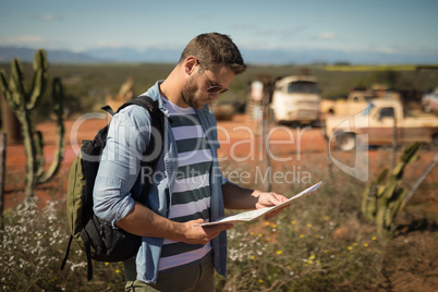 Man looking at map on a sunny day