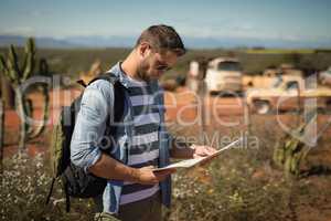 Man looking at map on a sunny day