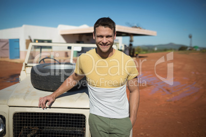 Man standing near his car