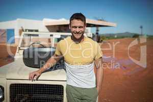 Man standing near his car