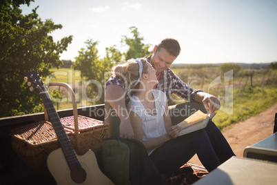 Couple relaxing in car on a sunny day