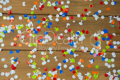 Confetti on wooden surface
