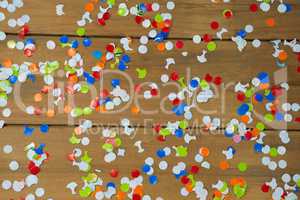 Confetti on wooden surface