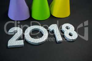 Colorful party hat with new year 2018 on black background