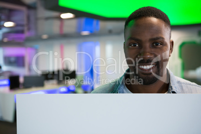 Portrait male executive holding a blank banner