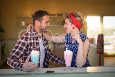 Couple romancing in restaurant