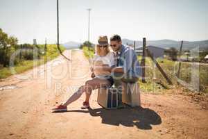 Couple looking at map on a sunny day