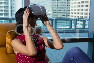 Female executive using virtual reality headset