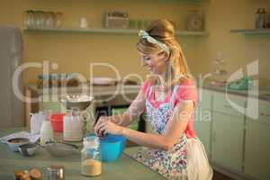 Waitress preparing food in restaurant