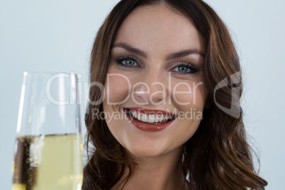 Smiling woman holding glass of champagne