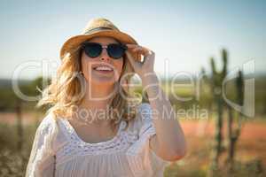 Woman in sunglasses smiling on a sunny day
