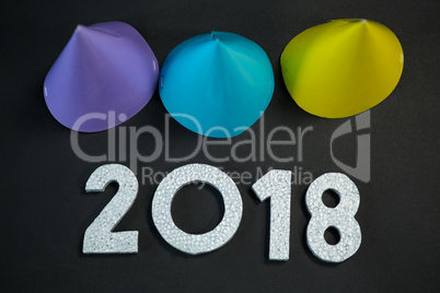 Colorful party hat with new year 2018 on black background