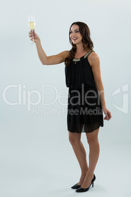 Smiling woman holding glass of champagne