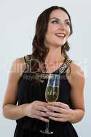 Smiling woman holding glass of champagne