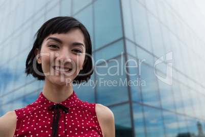 Female executive standing in office premises