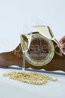 Champagne glass and clock on white background