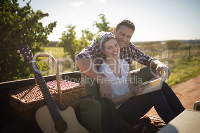 Couple relaxing in car on a sunny day