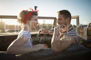 Couple interacting with each other in a car