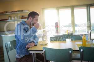 Man having coffee in restaurant