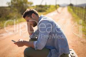 Man using mobile on a sunny day