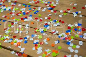 Confetti on wooden surface