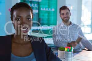 Portrait of confident female executive sitting at desk