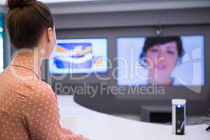 Female executive having video call in boardroom