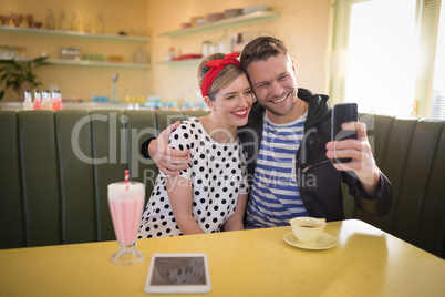 Couple taking selfie with mobile phone