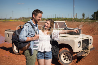 Couple standing together with backpack