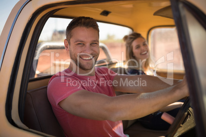 Couple sitting together in a car