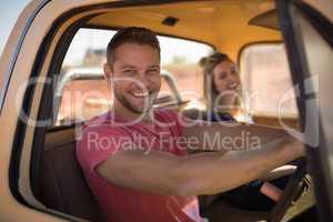 Couple sitting together in a car