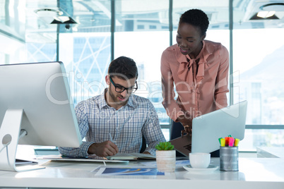 Executives working together at desk