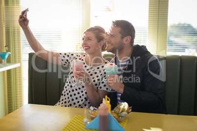 Couple taking selfie with mobile phone