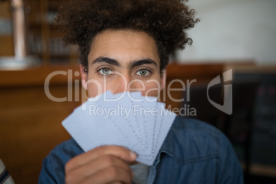 Man showing cards in bar