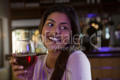 Woman holding wine glass