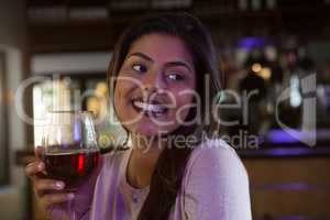 Woman holding wine glass