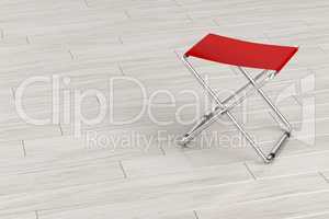 Folding stool on wooden floor