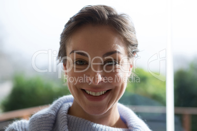 Smiling woman at home