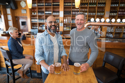 Two men having glass of bear at in restaurant