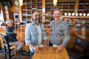 Two men having glass of bear at in restaurant